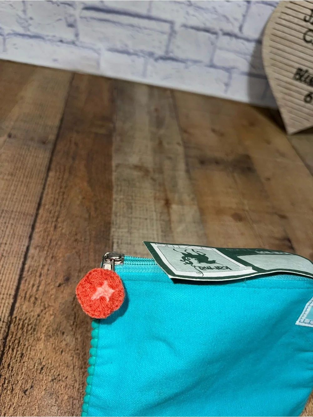 Karma living cat face Pom Pom pouch new with flaws